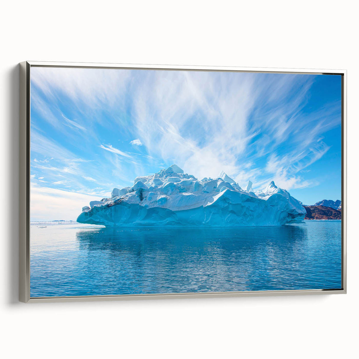 Framed canvas wall art showcasing a striking iceberg landscape design with a silver frame, highlighting vibrant blues and whites, perfect for modern decor.