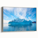 Framed canvas wall art showcasing a striking iceberg landscape design with a silver frame, highlighting vibrant blues and whites, perfect for modern decor.