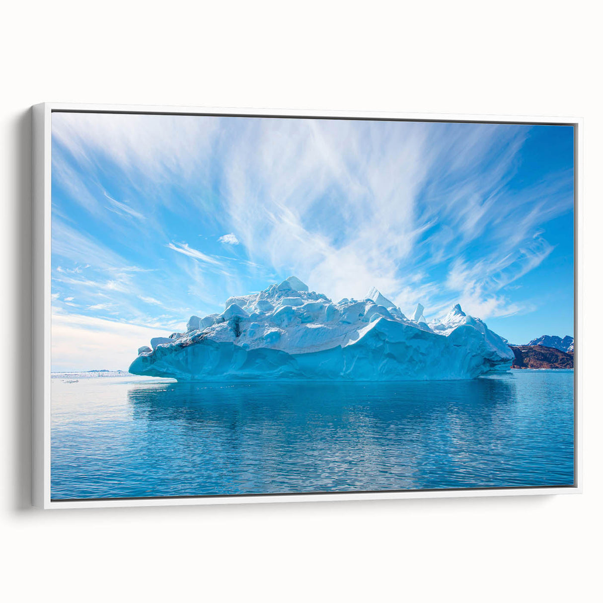 Framed canvas wall art showcasing a minimalist iceberg design in white and blue tones, perfect for modern home decor, displayed from a side view against a neutral background.