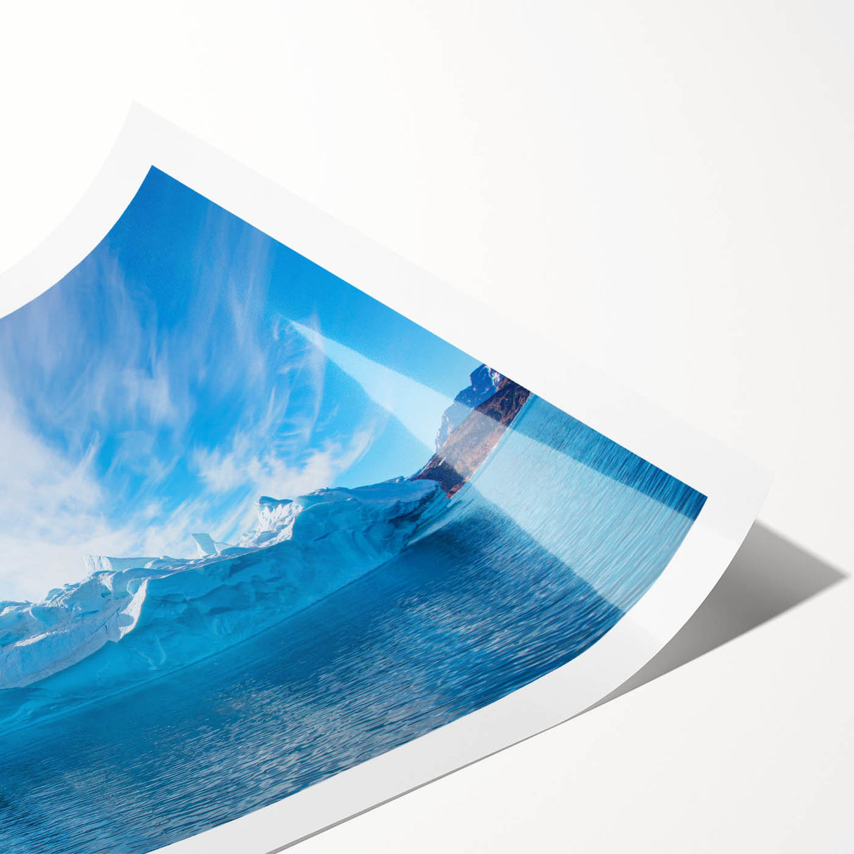 Vibrant rolled wall art print showcasing an abstract iceberg landscape design with cool blue tones, ideal for contemporary home decor. Packaged securely in a sturdy tube for safe delivery.