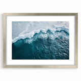 Framed wall art featuring a stunning iceberg landscape design with a silver mat. The piece showcases vibrant blues and whites, perfect for modern home decor.