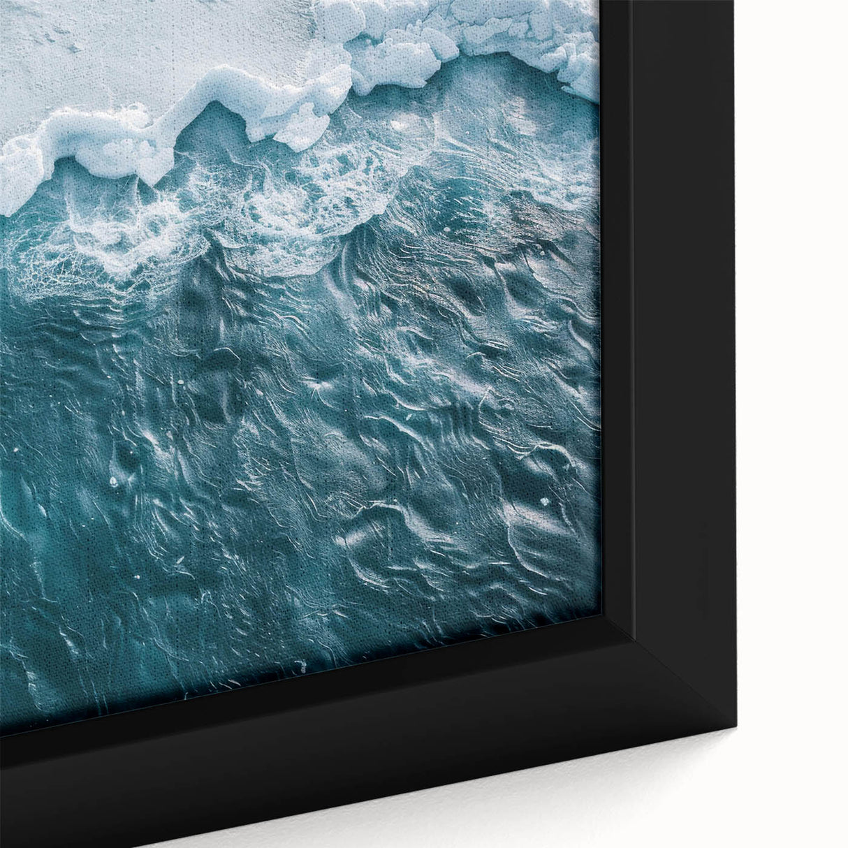 Close-up of a framed canvas artwork showcasing a stunning iceberg landscape design, featuring vibrant blues and whites, perfect for modern home decor.