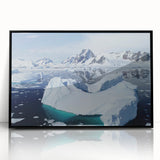 Framed acrylic wall art depicting a stunning iceberg landscape design, featuring vibrant blues and whites, set in a sleek black frame for a modern touch. Perfect for enhancing contemporary home decor.