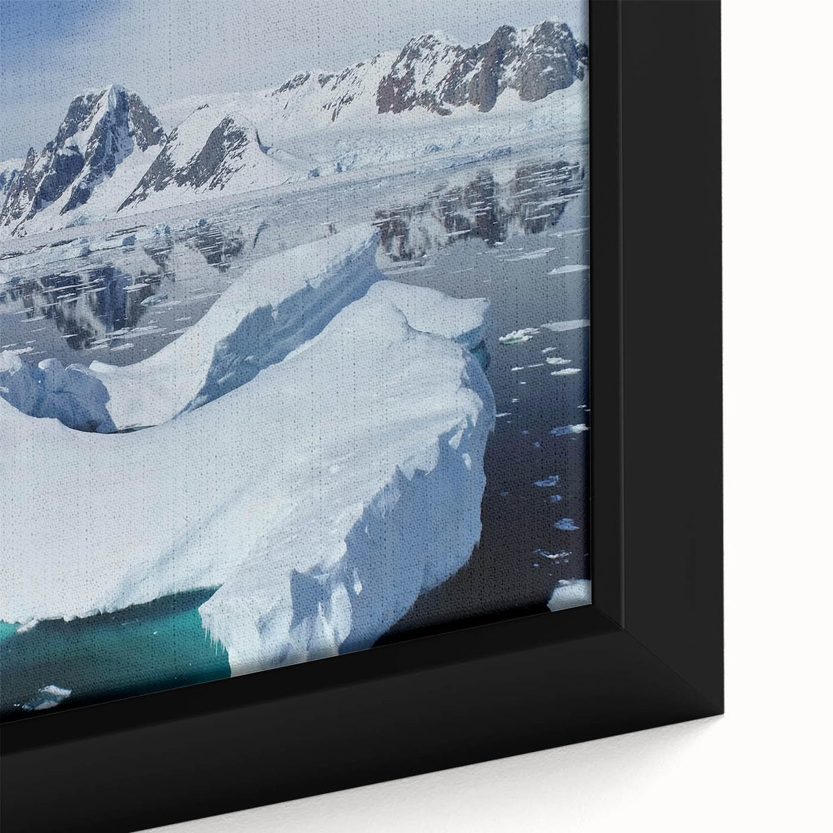 Close-up of a framed canvas featuring a serene iceberg landscape design, showcasing crisp blue and white tones, perfect for modern home decor and art enthusiasts.