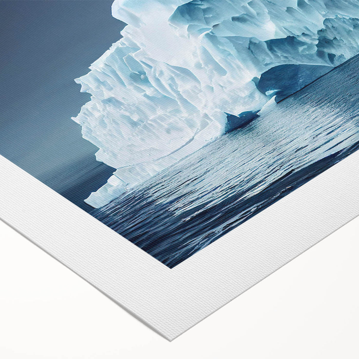 Stunning rolled canvas wall art depicting a serene iceberg landscape, showcasing cool blue and white hues, perfect for modern home décor and art enthusiasts.