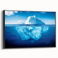 Framed canvas wall art featuring a contemporary iceberg design in shades of blue and white, showcasing a side view with a sleek black frame, ideal for modern decor.