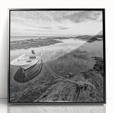 Framed acrylic wall art featuring a serene landscape of a lake surrounded by lush greenery and mountains, presented in a sleek black frame, ideal for home decor.