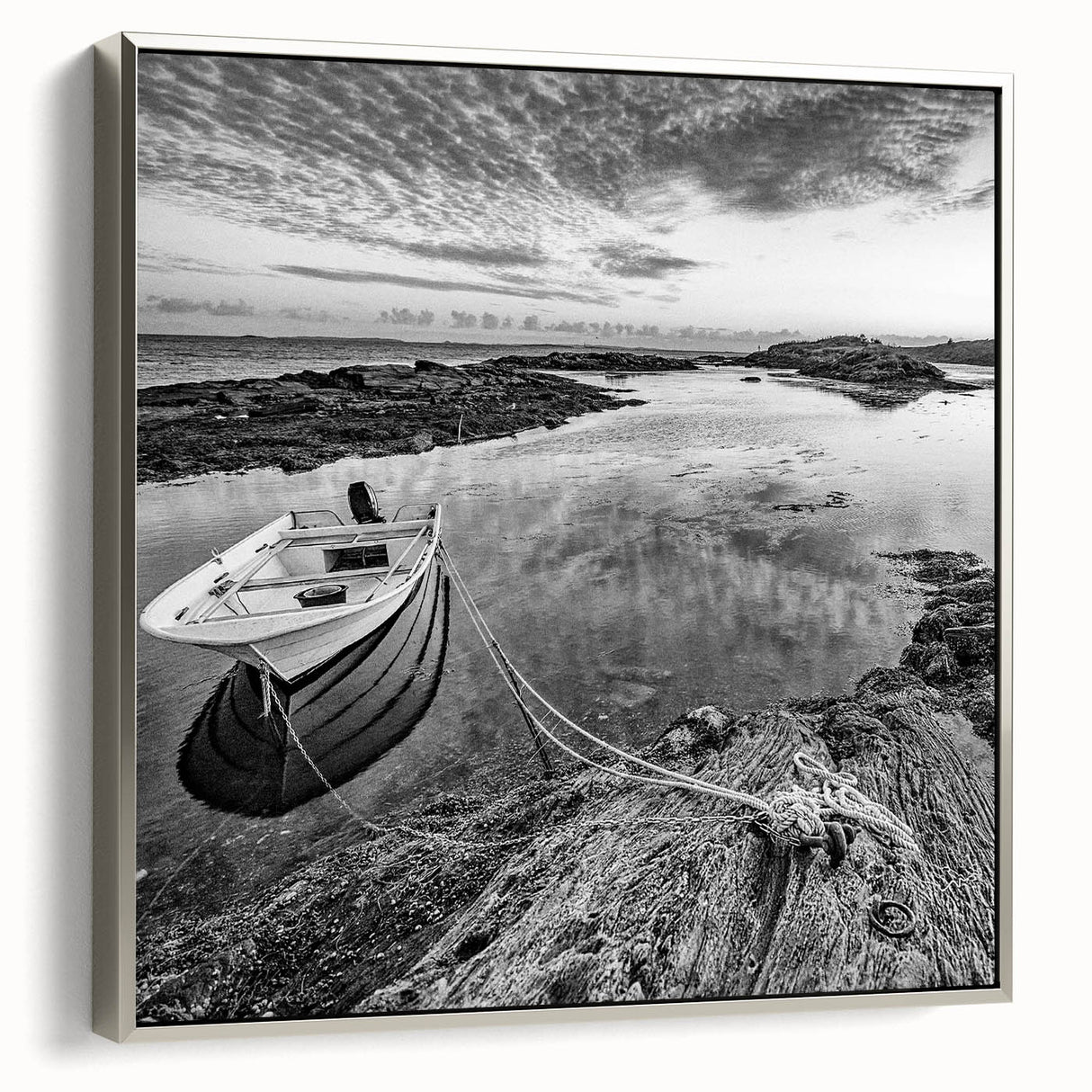 Framed canvas wall art showcasing a serene lakeside landscape in soft blue and green hues, elegantly bordered in silver, perfect for modern home decor.