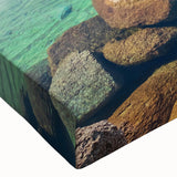 Close-up of a vibrant stretched canvas wall art piece showcasing a serene lake landscape with lush greenery and a clear blue sky, perfect for home decor.