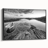 Framed canvas wall art showcasing a serene landscape with a tranquil lake scene, featuring vibrant colors and a sleek black frame, perfect for home decor.