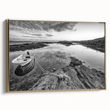 Framed canvas wall art featuring a serene landscape with a tranquil lake, surrounded by lush greenery and mountains, accented with a gold frame for elegance.