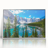 Framed acrylic wall art depicting a serene lakeside landscape with vibrant colors and intricate details, showcased in a sleek white frame, perfect for home decor.