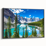Framed canvas wall art featuring a serene landscape with a tranquil lake, surrounded by lush greenery, presented in a sleek black frame from the Lakes Design collection.