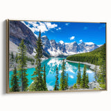 Framed canvas wall art featuring a serene lakeside landscape with vibrant greenery and soft blue waters, accented by a sleek gold frame, perfect for home decor.