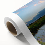 Serene landscape wall art featuring a tranquil lake scene, vibrant colors, and lush greenery, printed on rolled canvas for easy display and shipping.