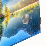 Close-up of a stunning acrylic glass wall art piece featuring a serene landscape of a tranquil lake surrounded by lush trees, ideal for modern home decor.