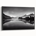 Framed canvas wall art featuring a serene lakeside landscape with vibrant colors, displayed in a sleek black frame, ideal for enhancing modern home decor.