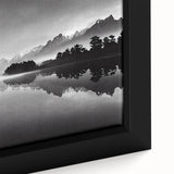 Close-up of a framed canvas artwork showcasing a serene lake landscape, featuring vibrant blues and greens, designed to enhance modern home decor aesthetics.