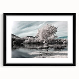 Framed wall art featuring a serene lake landscape, surrounded by a sleek black mat, ideal for home decor. Perfect for nature lovers seeking tranquility.