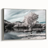 Framed canvas wall art showcasing a serene lake landscape design with silver accents, ideal for home decor. Side view highlights the elegant framing and artistic details.