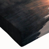 Close-up of a textured stretched canvas featuring a serene lake landscape design in vibrant blues and greens, perfect for enhancing home decor with nature-inspired art.