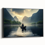 Framed canvas wall art showcasing a serene landscape with a tranquil lake, surrounded by lush greenery and a vibrant sunset, presented in a sleek black frame for an elegant touch.