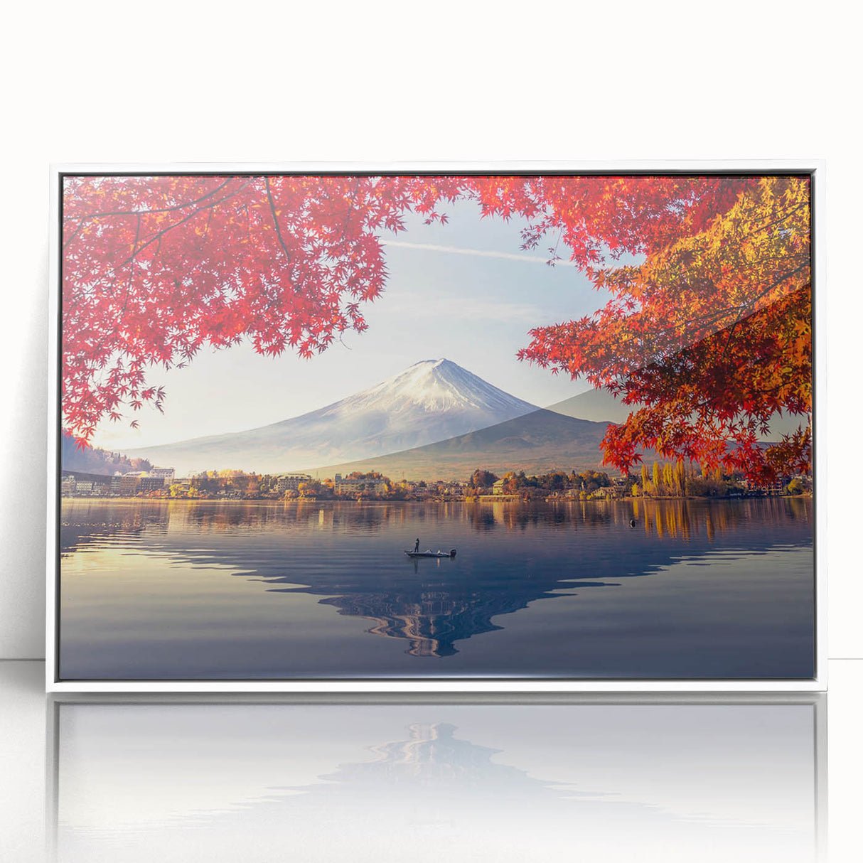 Framed wall art featuring a serene landscape of a tranquil lake surrounded by lush greenery, presented in an elegant white frame, ideal for home decor.