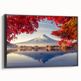 Framed canvas wall art showcasing a serene landscape with a tranquil lake, featuring rich colors and a black frame, ideal for home decor and aesthetic enhancement.