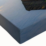 Close-up of a stretched canvas featuring a serene lake landscape design, showcasing vibrant blues and greens, ideal for home decor or artistic display.