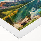 Vibrant rolled canvas artwork showcasing a serene lakeside landscape with lush greenery and tranquil water reflections, elegantly packaged for display.