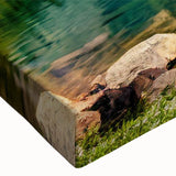 Close-up of a stretched canvas wall art piece showcasing a serene lakeside landscape design, featuring vibrant blues and greens, perfect for home decor.