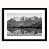 Framed wall art collection showcasing serene landscapes of lakes, presented in a sleek black frame with a white mat, ideal for modern home decor.