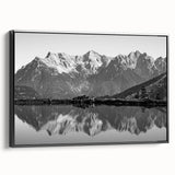 Framed canvas wall art collection showcasing serene lake landscapes with vibrant colors, displayed from a side view to highlight its black frame and artistic depth.
