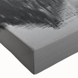 Close-up of a vibrant stretched canvas wall art featuring serene lake landscapes, showcasing rich colors and intricate details, perfect for home decor enhancement.