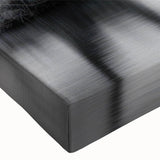 Close-up of a stretched canvas wall art piece depicting a serene lake landscape, featuring vibrant blues and greens that evoke tranquility and nature's beauty. Perfect for home decor, this piece enhances any living space with a calming ambiance.