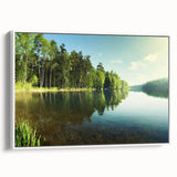 Framed canvas wall art showcasing a serene lake landscape in soft blues and greens, designed for home decor with a modern aesthetic, viewed from the side.