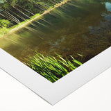 Serene landscape wall art on rolled canvas, showcasing a tranquil lake scene with vivid colors and reflections, ideal for home decor and interior design.