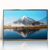 Framed wall art featuring a serene landscape with a lake and mountains, highlighted by gold accents, ideal for modern home decor. Perfect for enhancing any living space.