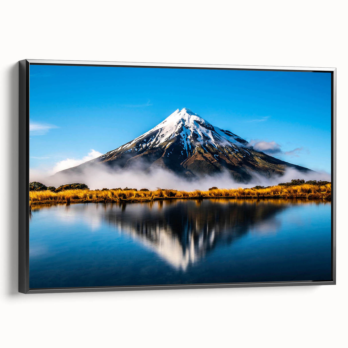 Framed canvas wall art showcasing a serene lake landscape design, featuring lush greenery and calm waters, presented in a sleek black frame for an elegant display.