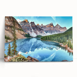 Stretched canvas wall art showcasing a serene lake landscape design with vibrant blues and greens, elegantly leaning against a textured wall for a modern decor touch.