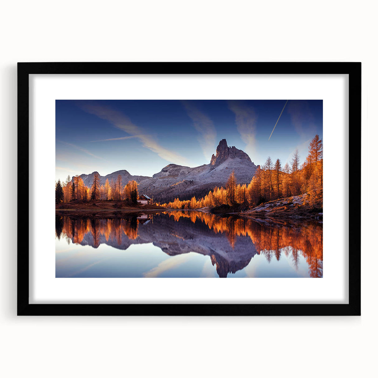 Black-framed wall art piece showcasing a serene lake landscape, elegantly matted for a polished look, perfect for enhancing modern home decor aesthetics.