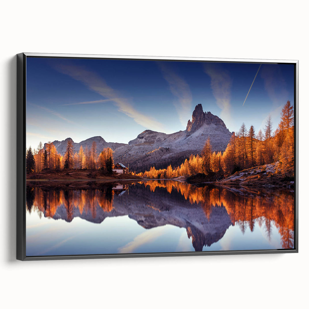 Framed canvas wall art showcasing a serene lake landscape in vibrant colors, featuring a sleek black frame. Perfect for enhancing modern decor in living spaces.