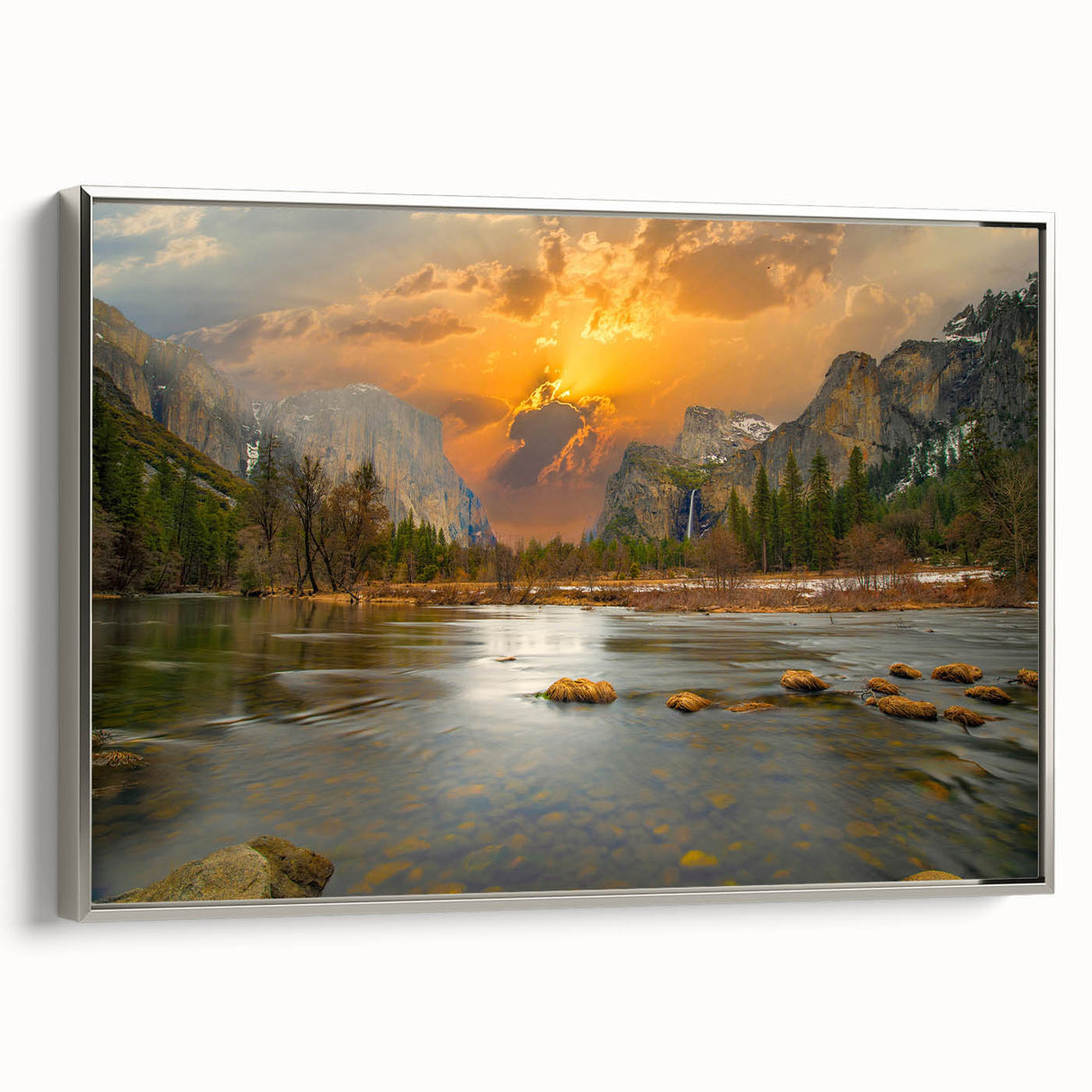 Framed canvas wall art showcasing a serene lakeside landscape in vibrant colors, featuring a silver frame and displayed at a side angle, perfect for home decor.