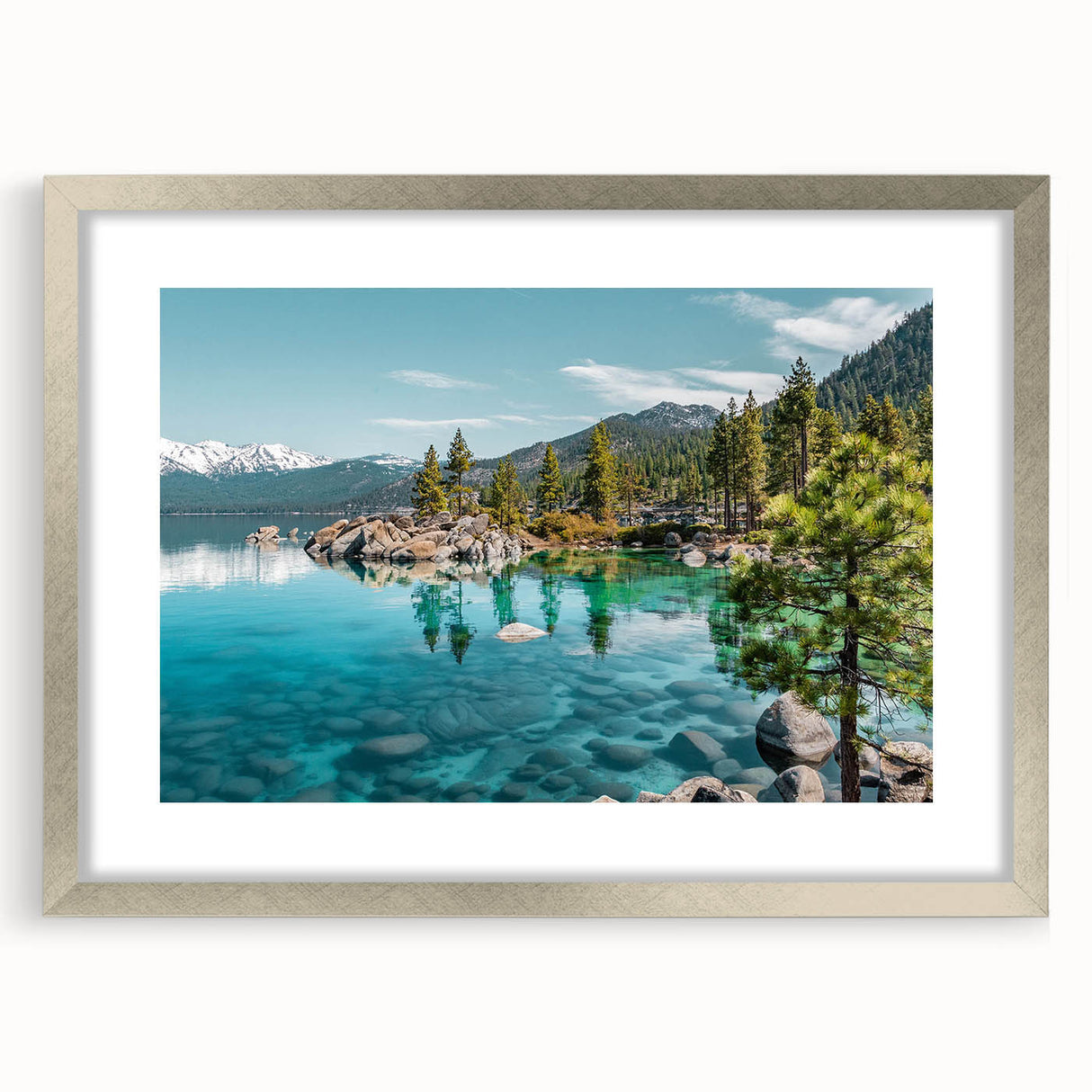 Framed wall art showcasing a tranquil lake landscape with a silver mat, perfect for enhancing home decor and creating a serene atmosphere in any room.