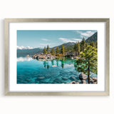Framed wall art showcasing a tranquil lake landscape with a silver mat, perfect for enhancing home decor and creating a serene atmosphere in any room.