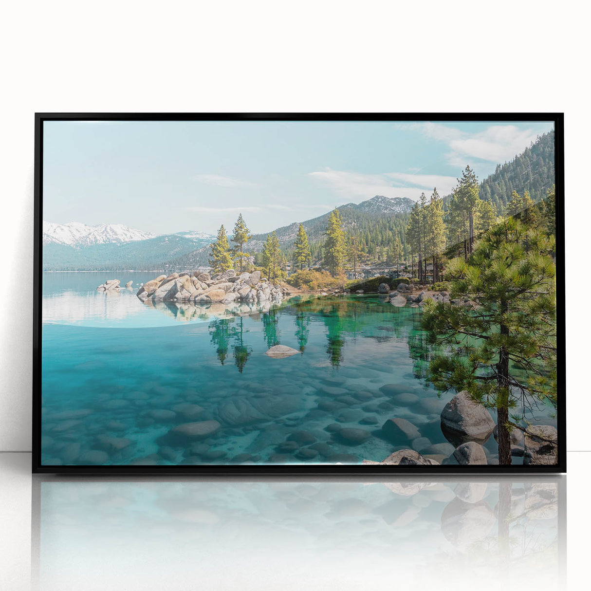 Framed wall art featuring a serene lakeside landscape design with vibrant colors, set in a sleek black frame that enhances the artwork's beauty.