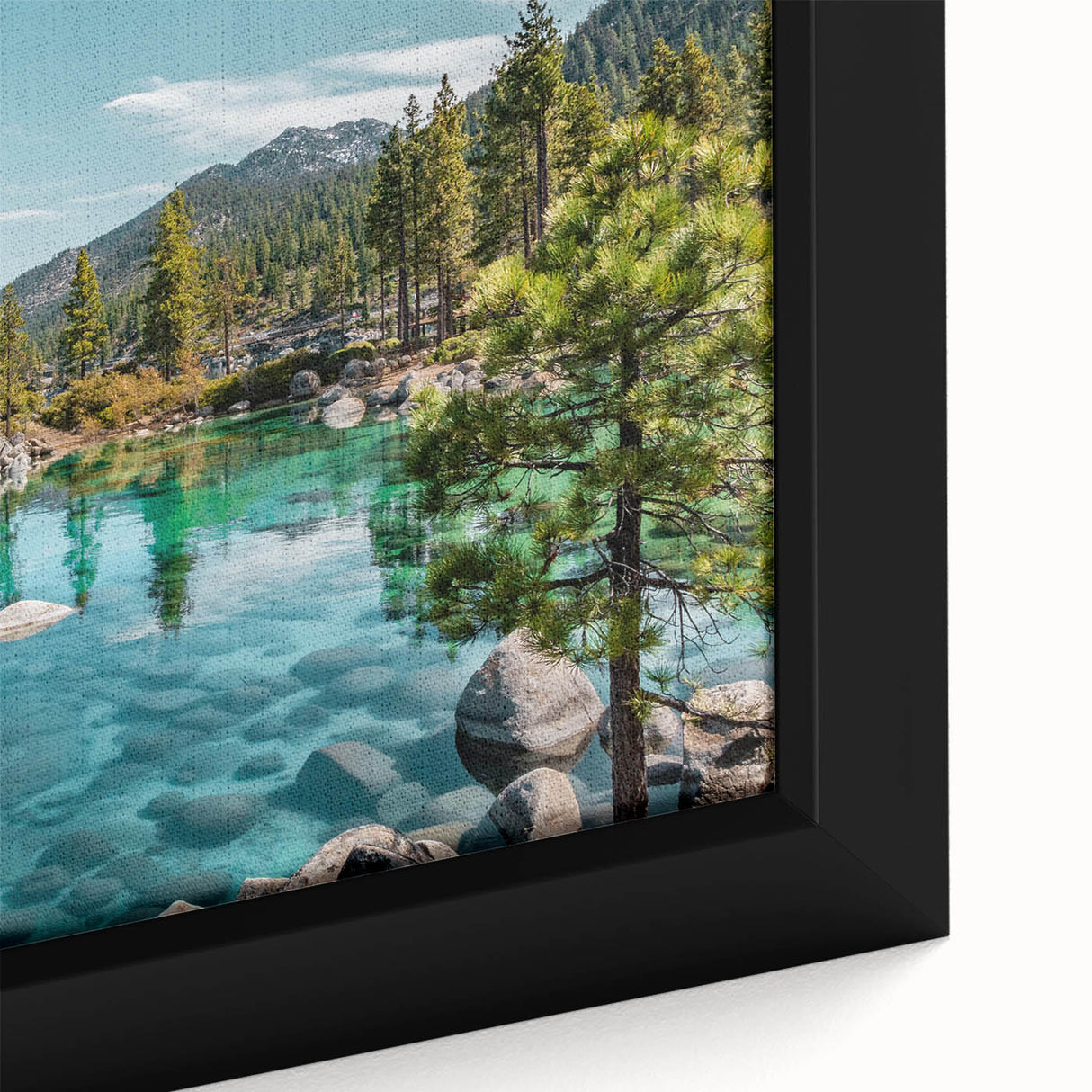 Close-up of a framed canvas artwork showcasing a serene lake landscape, featuring vibrant blues and greens, ideal for home decor and wall art enthusiasts.
