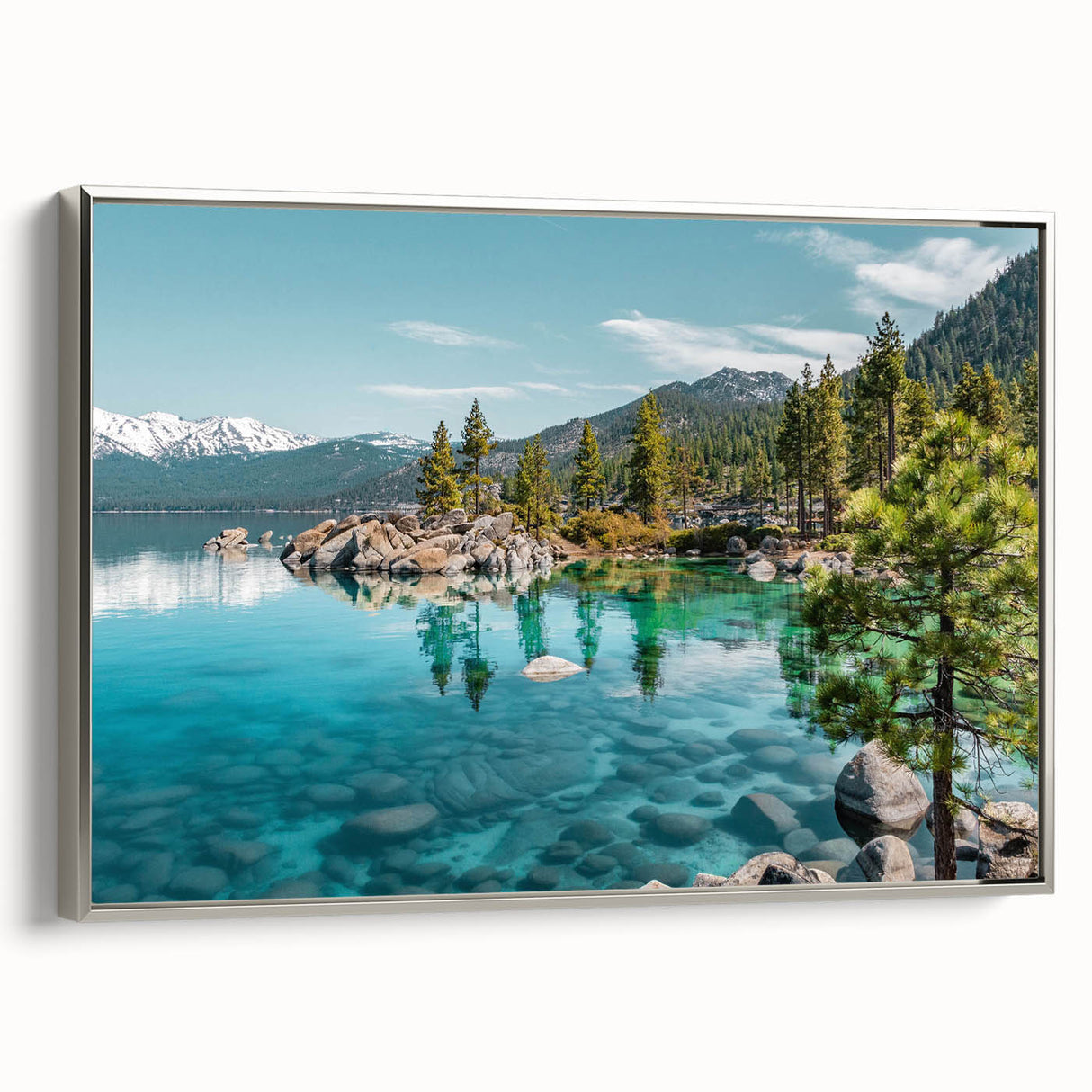 Framed canvas wall art showcasing a serene lake landscape design with vibrant colors and a sleek silver frame, ideal for modern home decor.