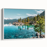 Framed canvas wall art showcasing a serene lake landscape design with vibrant colors and intricate details, displayed at a slight angle against a white background.
