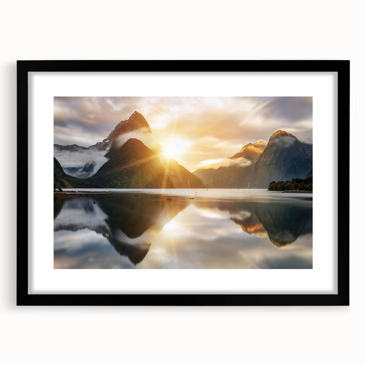 Framed wall art featuring a serene landscape of a tranquil lake surrounded by lush greenery, presented in a sleek black frame with a white mat, perfect for home decor.
